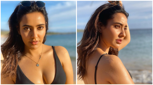 Neha Sharma flaunts her hourglass figure in a bikini from her recent vacation pictures.