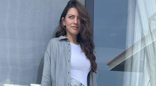 Hansika Motwani Lessons On How To Rock A White Tee With Denim Shorts.