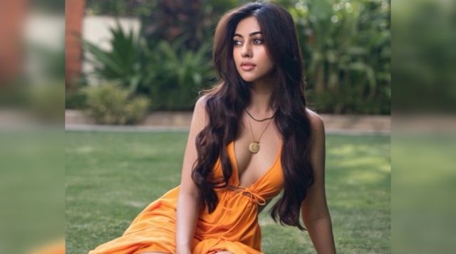 Anu Emmanuel Goes Bold As She Opts A Breathtaking Orange Dress.